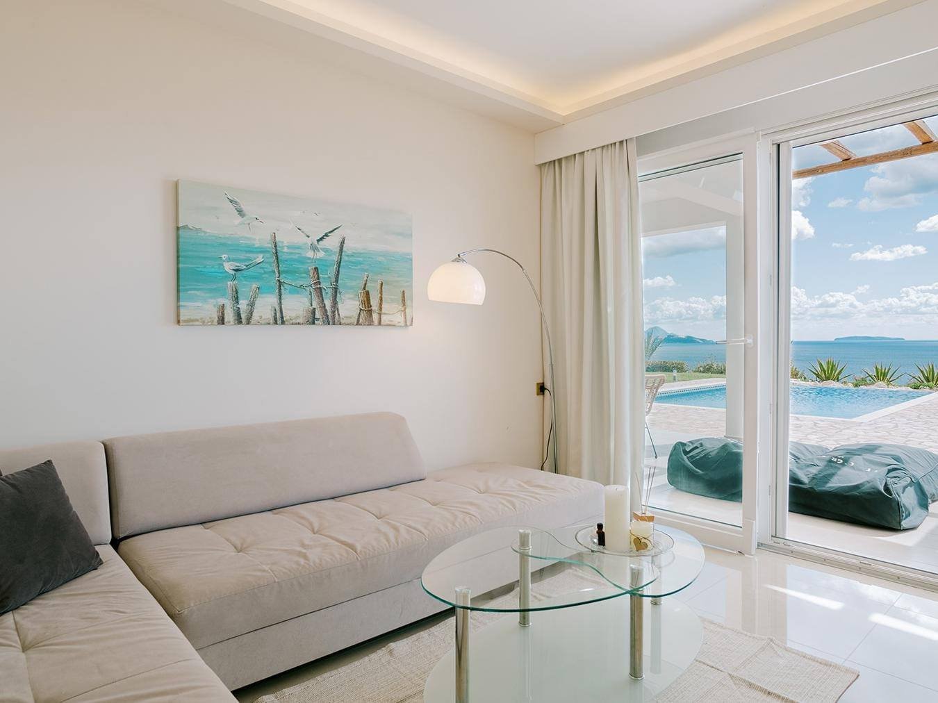 Villa Afrodite living room opening onto the pool terrace