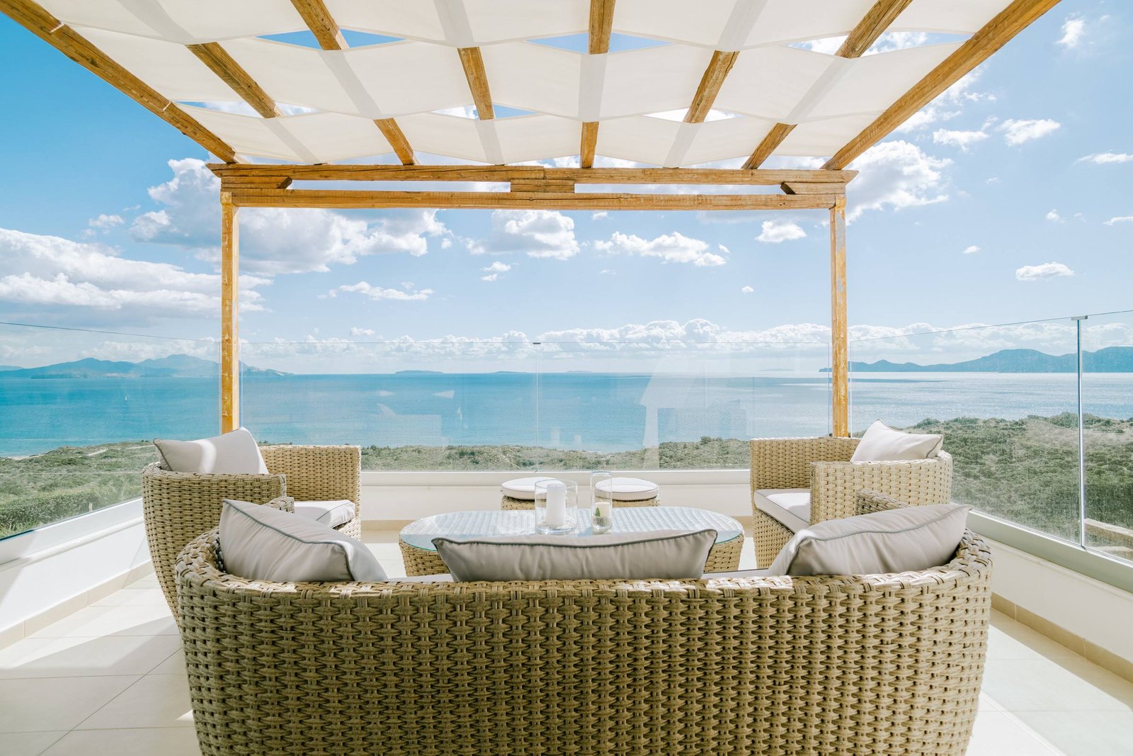 Balcony lounge overlooking the hills and the Aegean
