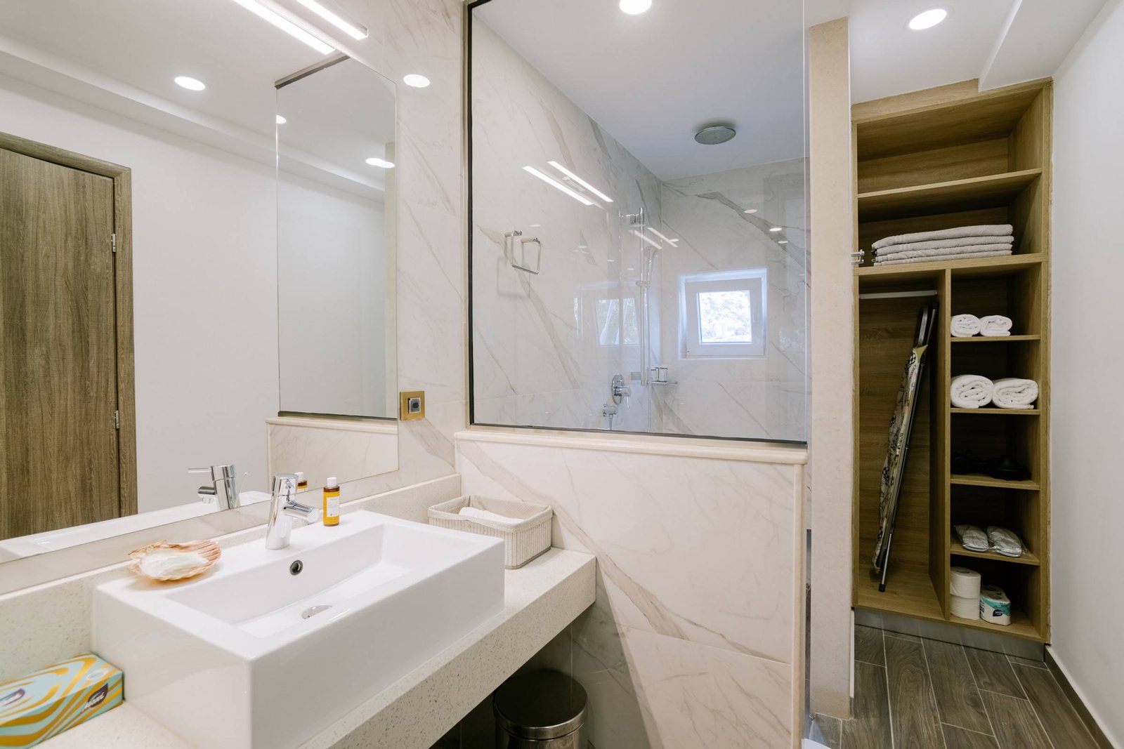 Modern bathroom with walk-in shower and marble