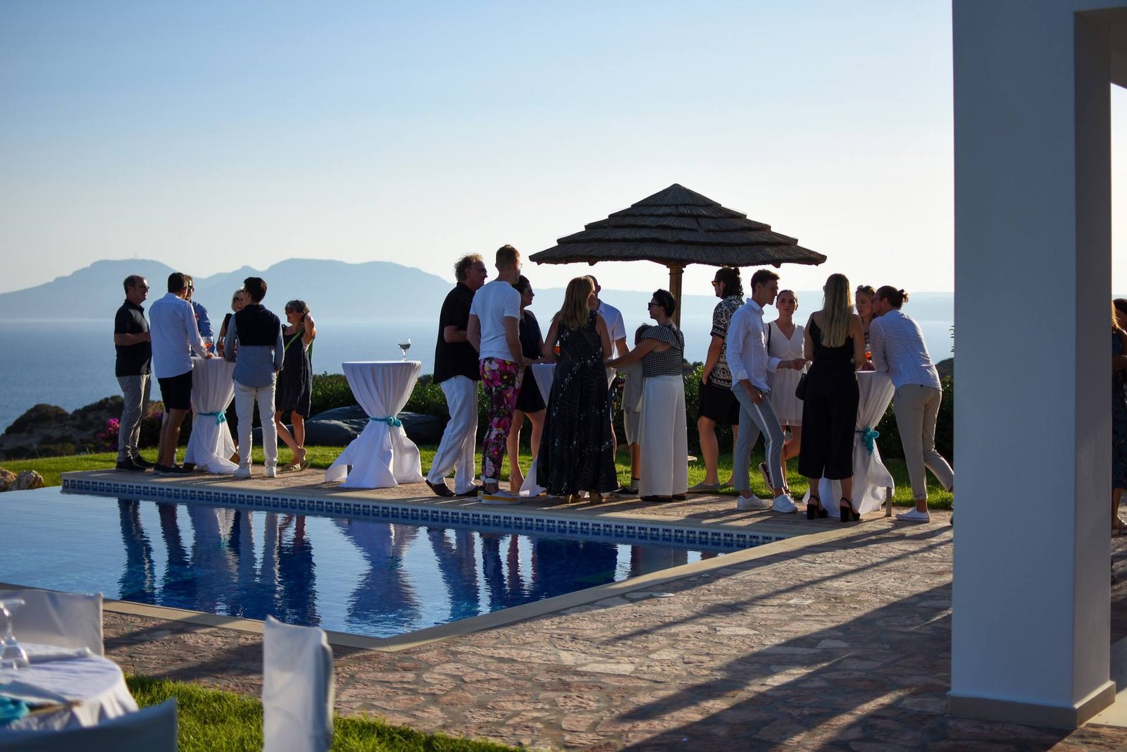 Poolside reception with islands on the horizon