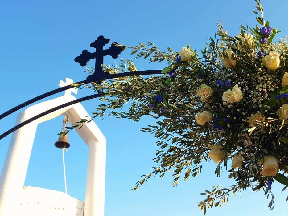 Chapel bell tower with wedding flowers