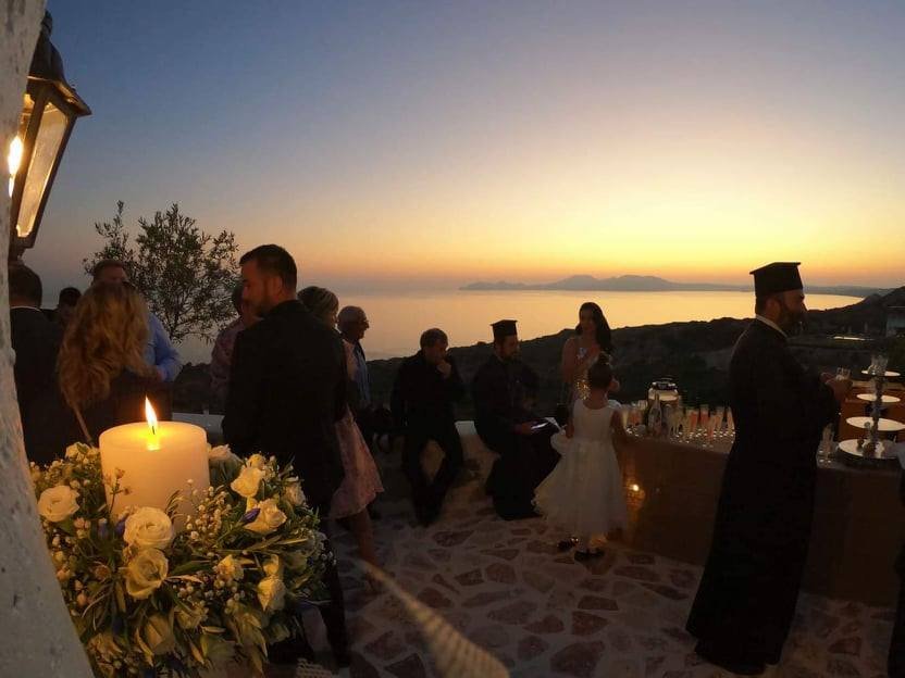 Wedding ceremony at the chapel at sunset overlooking the sea